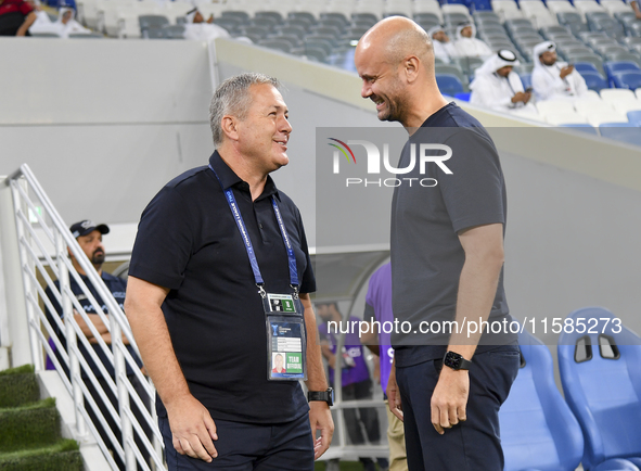 Dragan Skocic, head coach of Tractor SC, and Miguel Angel Ramirez Medina, head coach of Al Wakrah SC, react prior to the AFC Champions Leagu...