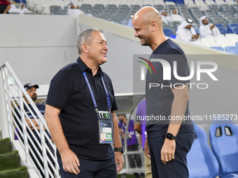 Dragan Skocic, head coach of Tractor SC, and Miguel Angel Ramirez Medina, head coach of Al Wakrah SC, react prior to the AFC Champions Leagu...