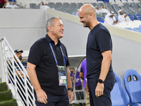 Dragan Skocic, head coach of Tractor SC, and Miguel Angel Ramirez Medina, head coach of Al Wakrah SC, react prior to the AFC Champions Leagu...