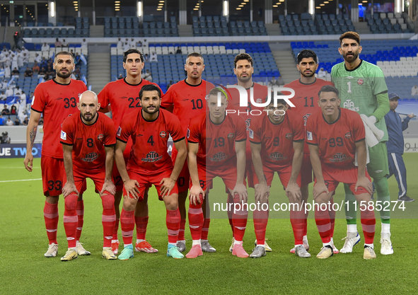 Tractor SC players pose for a team photo prior to the AFC Champions League Two Group A football match between Qatar's Al Wakrah SC and Iran'...