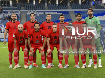 Tractor SC players pose for a team photo prior to the AFC Champions League Two Group A football match between Qatar's Al Wakrah SC and Iran'...