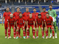 Tractor SC players pose for a team photo prior to the AFC Champions League Two Group A football match between Qatar's Al Wakrah SC and Iran'...