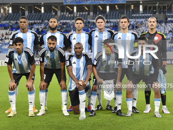 Al Wakrah SC players pose for a team photo prior to the AFC Champions League Two Group A football match between Qatar's Al Wakrah SC and Ira...