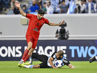 Aissa Belal Laidouni (R) of Al Wakrah SC battles for the ball with Mahdi Torabi of Tractor SC during the AFC Champions League football match...