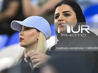 Tractor SC supporters cheer for their team during the AFC Champions League Two Group A football match between Qatar's Al Wakrah SC and Iran'...