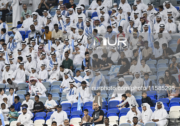 Al Wakrah SC supporters cheer for their team before the AFC Champions League Two Group A football match between Qatar's Al Wakrah SC and Ira...