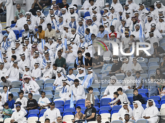 Al Wakrah SC supporters cheer for their team before the AFC Champions League Two Group A football match between Qatar's Al Wakrah SC and Ira...