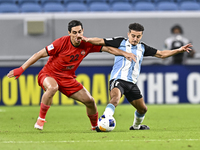 Ayoub Assal (R) of Al Wakrah SC battles for the ball with Mohammad Naderi of Tractor SC during the AFC Champions League elite football match...