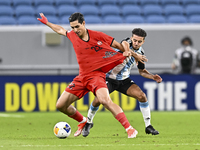 Ayoub Assal (R) of Al Wakrah SC battles for the ball with Mohammad Naderi of Tractor SC during the AFC Champions League elite football match...