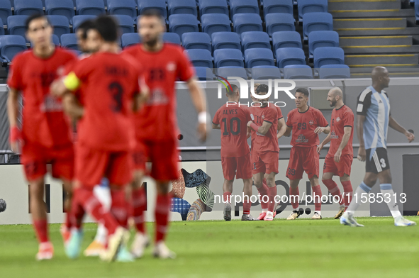 Tomislav Strkalj (#19) of Tractor SC celebrates with his teammates after scoring the opening goal during the AFC Champions League elite foot...