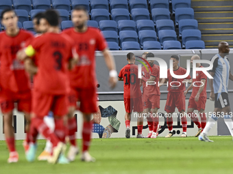 Tomislav Strkalj (#19) of Tractor SC celebrates with his teammates after scoring the opening goal during the AFC Champions League elite foot...