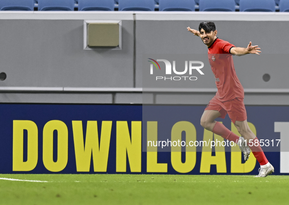 Mahdi Torabi of Tractor SC celebrates after scoring the second goal during the AFC Champions League elite football match between Qatar's Al...