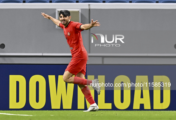 Mahdi Torabi of Tractor SC celebrates after scoring the second goal during the AFC Champions League elite football match between Qatar's Al...