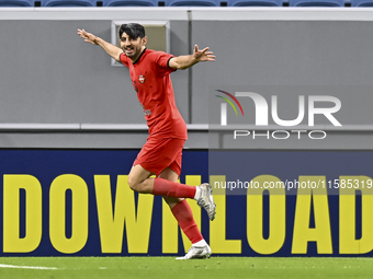 Mahdi Torabi of Tractor SC celebrates after scoring the second goal during the AFC Champions League elite football match between Qatar's Al...