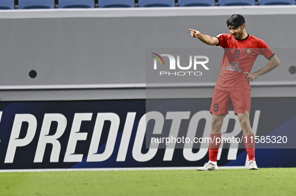 Mahdi Torabi of Tractor SC celebrates after scoring the second goal during the AFC Champions League elite football match between Qatar's Al...