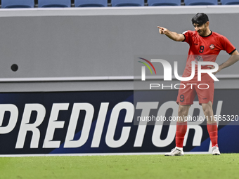 Mahdi Torabi of Tractor SC celebrates after scoring the second goal during the AFC Champions League elite football match between Qatar's Al...