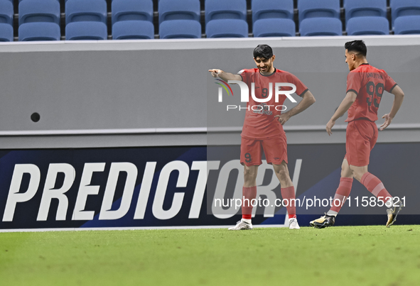 Mahdi Torabi of Tractor SC celebrates after scoring the second goal during the AFC Champions League elite football match between Qatar's Al...