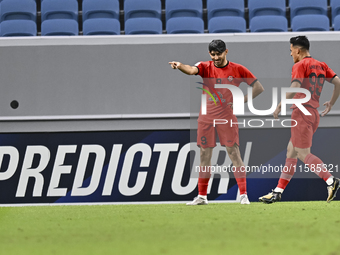 Mahdi Torabi of Tractor SC celebrates after scoring the second goal during the AFC Champions League elite football match between Qatar's Al...