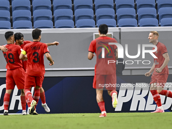 Mahdi Torabi (2-L) of Tractor SC celebrates after scoring the second goal during the AFC Champions League football match between Qatar's Al...