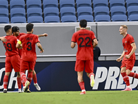 Mahdi Torabi (2-L) of Tractor SC celebrates after scoring the second goal during the AFC Champions League football match between Qatar's Al...