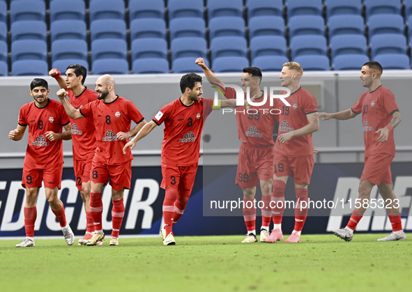 Mahdi Torabi of Tractor SC celebrates after scoring the second goal during the AFC Champions League football match between Qatar's Al Wakrah...