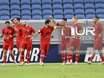 Mahdi Torabi of Tractor SC celebrates after scoring the second goal during the AFC Champions League football match between Qatar's Al Wakrah...