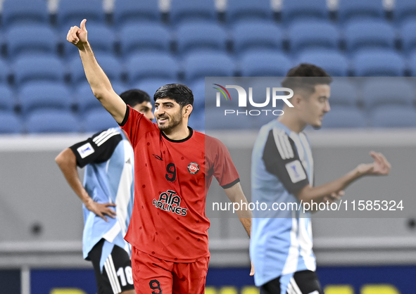 Mahdi Torabi of Tractor SC celebrates after scoring the second goal during the AFC Champions League football match between Qatar's Al Wakrah...