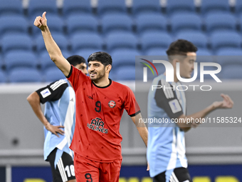 Mahdi Torabi of Tractor SC celebrates after scoring the second goal during the AFC Champions League football match between Qatar's Al Wakrah...