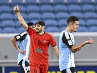 Mahdi Torabi of Tractor SC celebrates after scoring the second goal during the AFC Champions League football match between Qatar's Al Wakrah...