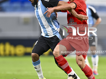 Aissa Belal Laidouni of Al Wakrah SC battles for the ball with Amirhossein Hosseinzadeh of Tractor SC during the AFC Champions League footba...