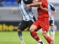 Aissa Belal Laidouni of Al Wakrah SC battles for the ball with Amirhossein Hosseinzadeh of Tractor SC during the AFC Champions League footba...