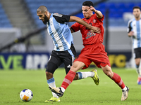 Aissa Belal Laidouni of Al Wakrah SC battles for the ball with Amirhossein Hosseinzadeh of Tractor SC during the AFC Champions League footba...