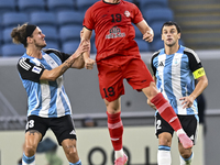 Alexander Scholz of Al Wakrah SC battles for the ball with Tomislav Strkalj of Tractor SC during the AFC Champions League football match bet...