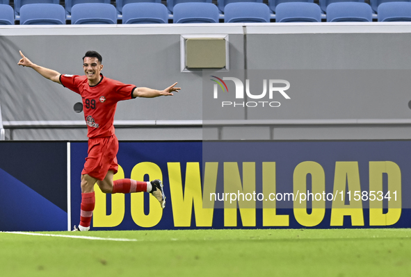 Amirhossein Hosseinzadeh of Tractor SC celebrates after scoring a goal during the AFC Champions League football match between Qatar's Al Wak...