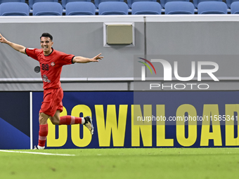 Amirhossein Hosseinzadeh of Tractor SC celebrates after scoring a goal during the AFC Champions League football match between Qatar's Al Wak...