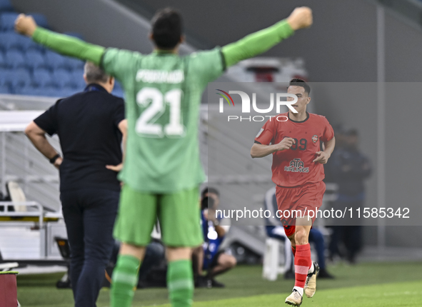 Amirhossein Hosseinzadeh of Tractor SC celebrates after scoring a goal during the AFC Champions League football match between Qatar's Al Wak...