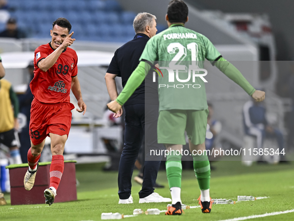 Amirhossein Hosseinzadeh of Tractor SC celebrates after scoring a goal during the AFC Champions League football match between Qatar's Al Wak...