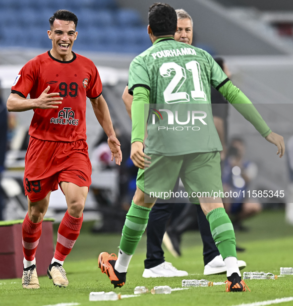 Amirhossein Hosseinzadeh of Tractor SC celebrates after scoring a goal during the AFC Champions League football match between Qatar's Al Wak...