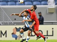 Abdelaziz Khaled S Metwalli (L) of Al Wakrah SC battles for the ball with Seyed Mehdi Hosseini of Tractor SC during the AFC Champions League...