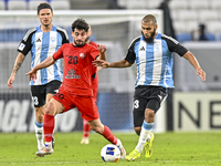 Aissa Belal Laidouni of Al Wakrah SC battles for the ball with Mahdi Hashemnezhad of Tractor SC during the AFC Champions League football mat...