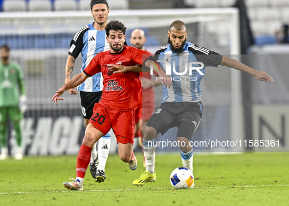 Aissa Belal Laidouni of Al Wakrah SC battles for the ball with Mahdi Hashemnezhad of Tractor SC during the AFC Champions League football mat...