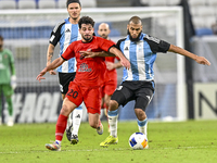 Aissa Belal Laidouni of Al Wakrah SC battles for the ball with Mahdi Hashemnezhad of Tractor SC during the AFC Champions League football mat...