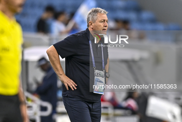 Dragan Skocic, head coach of Tractor SC, reacts during the AFC Champions League football match between Qatar's Al Wakrah SC and Iran's Tract...