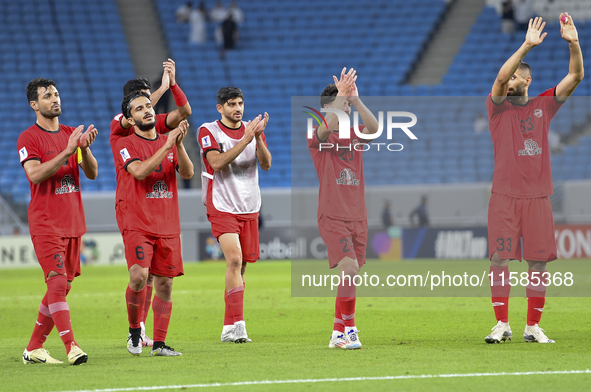 Tractor SC Al Hilal SFC players celebrate after the AFC Champions League football match between Qatar's Al Wakrah SC and Iran's Tractor SC a...