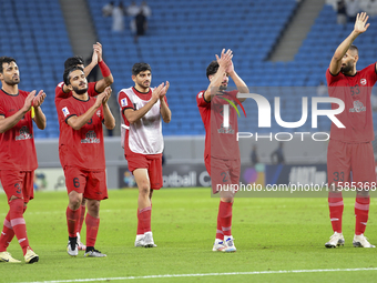 Tractor SC Al Hilal SFC players celebrate after the AFC Champions League football match between Qatar's Al Wakrah SC and Iran's Tractor SC a...