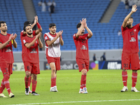 Tractor SC Al Hilal SFC players celebrate after the AFC Champions League football match between Qatar's Al Wakrah SC and Iran's Tractor SC a...