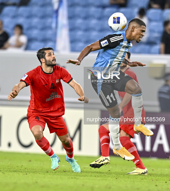 Ricardo Jorge Gomes of Al Wakrah SC battles for the ball with Aref Gholami of Tractor SC during the AFC Champions League football match betw...