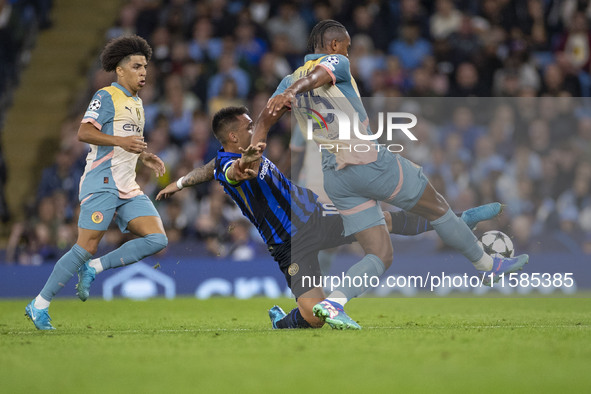 Lautaro Martinez #10 of Inter Milan tackles Manuel Akanji #25 of Manchester City F.C. during the UEFA Champions League League Stage match be...