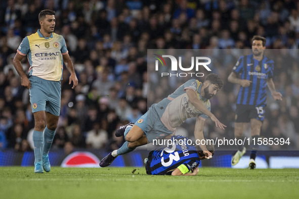 Nicolo Barella #23 of Inter Milan is tackled by Josko Gvardiol #24 of Manchester City F.C. during the UEFA Champions League League Stage mat...