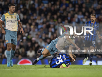 Nicolo Barella #23 of Inter Milan is tackled by Josko Gvardiol #24 of Manchester City F.C. during the UEFA Champions League League Stage mat...